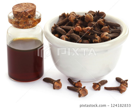 Fresh clove with oil in a jar Fresh clove with oil in a jar 124182833