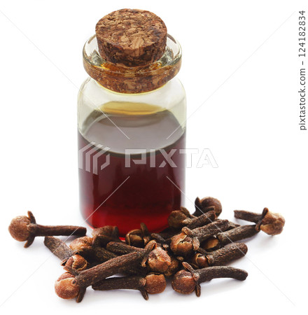 Fresh clove with oil in a jar Fresh clove with oil in a jar 124182834