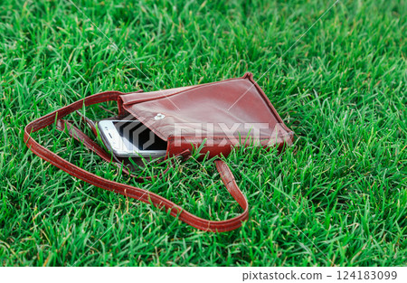 Cell phone in a leather parts 124183099