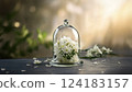 Pure white flowers in a glass dome 124183157