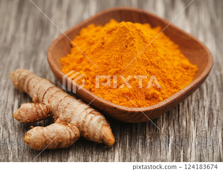 Raw turmeric with powder Raw turmeric with powder 124183674