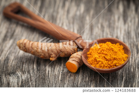 Raw turmeric with powder Raw turmeric with powder 124183688