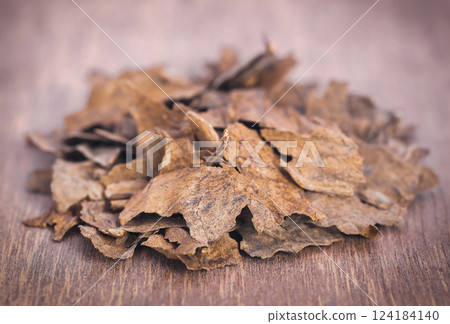 Dry tobacco leaves Dry tobacco leaves 124184140