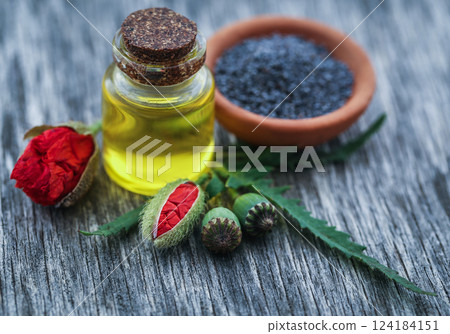 Poppy seeds with essential oil 124184151