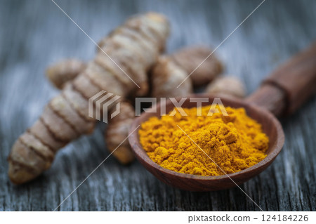 Raw turmeric with powder Raw turmeric with powder 124184226