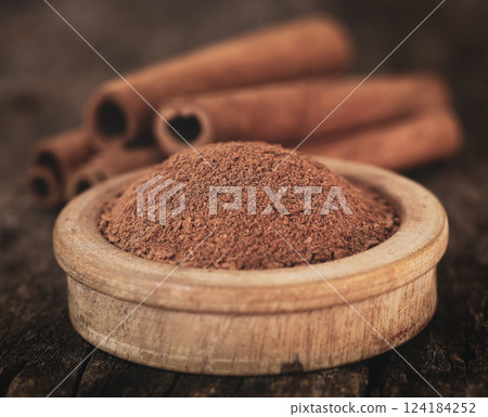 Fresh aromatic cinnamon with ground spice 124184252