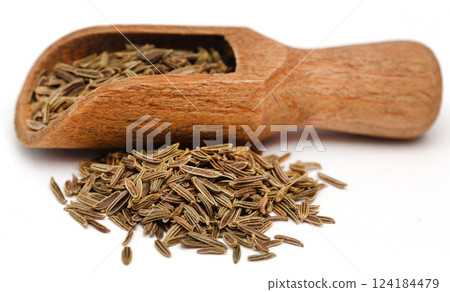 Cumin in wooden scoop 124184479