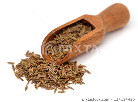 Cumin in wooden scoop 124184480