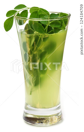 Moringa leaves with extract in a glass Moringa leaves with extract in a glass 124184709