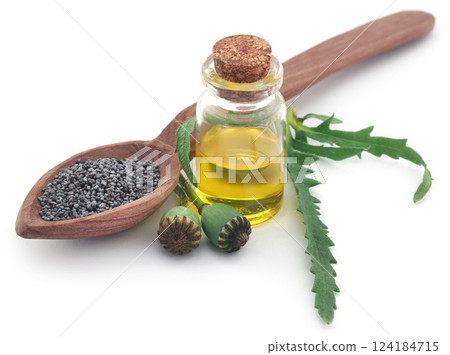 Poppy seeds and extract in a bottle 124184715
