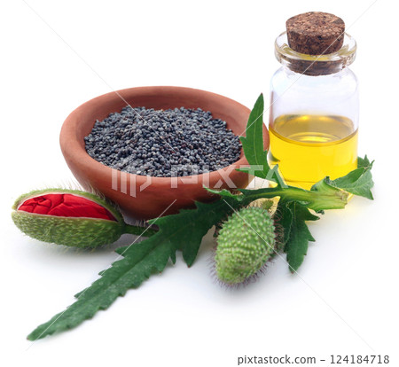 Poppy flower seeds and extract in a bottle 124184718