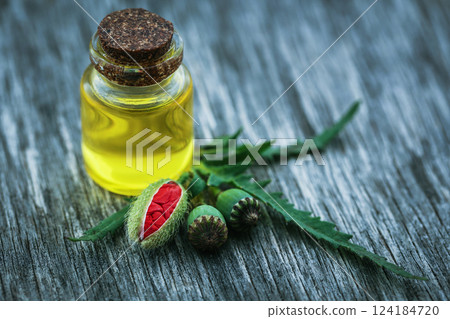 Poppy seeds with essential oil Poppy seeds with essential oil 124184720