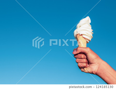 Hand holding an icecream Hand holding an icecream 124185130