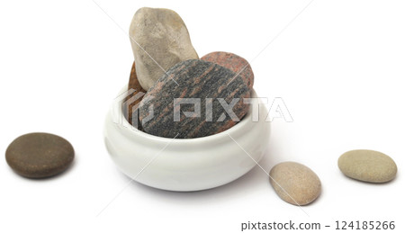 Stone in a bowl Stone in a bowl 124185266