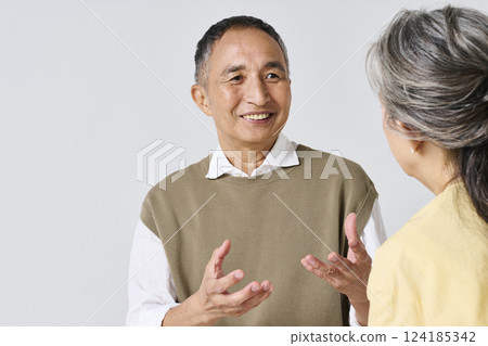 Senior men and women having a fun conversation Senior men and women having a fun conversation 124185342