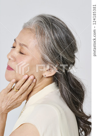 Portrait of a senior woman smiling elegantly 124185381