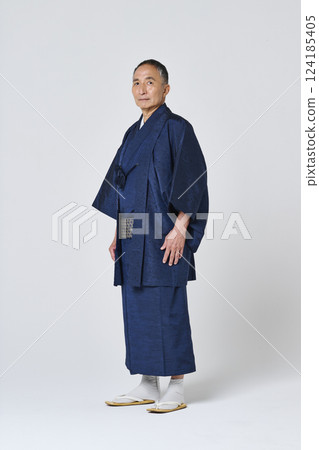 Portrait of a senior man in a navy blue kimono Portrait of a senior man in a navy blue kimono 124185405