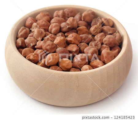 Raw chickpea in a wooden bowl Raw chickpea in a wooden bowl 124185423