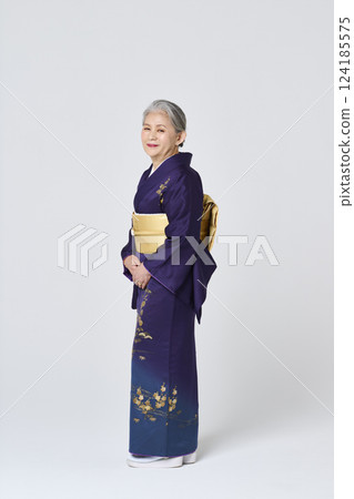 Senior woman wearing purple kimono Senior woman wearing purple kimono 124185575