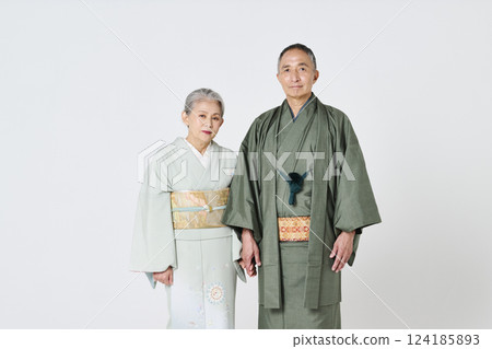 Senior couple in kimono holding hands Senior couple in kimono holding hands 124185893