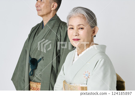 Senior couple wearing kimonos smiling happily Senior couple wearing kimonos smiling happily 124185897