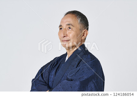 Portrait of a senior man in a navy blue kimono Portrait of a senior man in a navy blue kimono 124186054