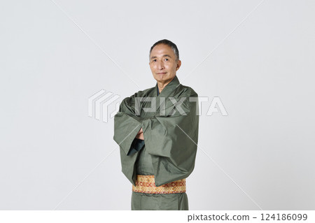 Portrait of a senior man in a green kimono 124186099