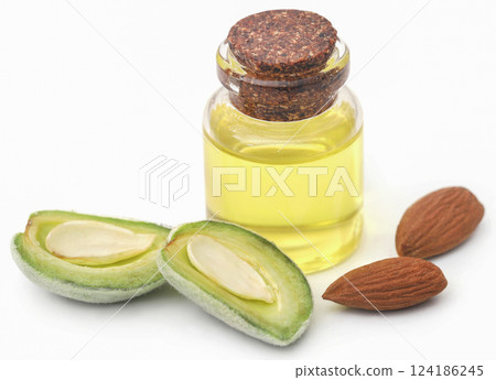 Green and peeled almond and essential oil Green and peeled almond and essential oil 124186245