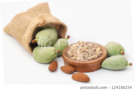 Crushed with green and peeled almond 124186254