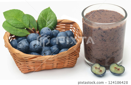 Fresh blueberries and juice in a glass 124186428