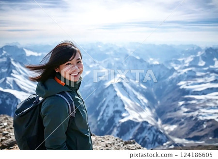 A woman enjoying the exhilaration of reaching the summit 124186605