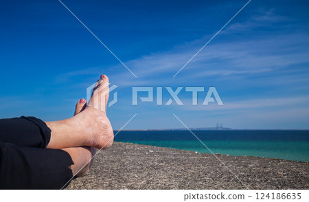Relaxing feet on the top of Dragor fort Denmark Relaxing feet on the top of Dragor fort Denmark 124186635