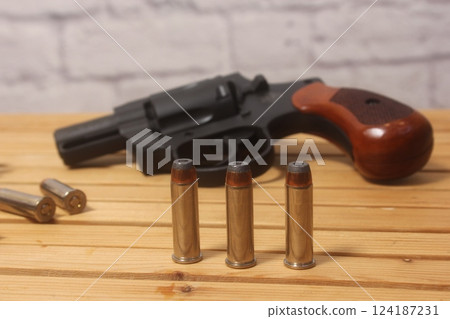 Vintage Revolver Gun With Ammunition and Speed Loader Vintage Revolver Gun With Ammunition and Speed Loader 124187231