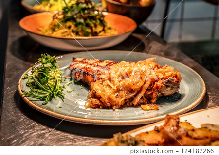 A top sirloin steak flame broiled on a barbecue shallow depth of field. 124187266