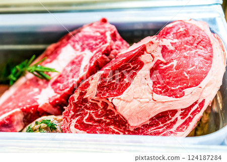 Steaks. Grade A grass fed beef, waygu steaks in butchers block. Traditional classic selection meat sold at butcher shop Steaks. Grade A grass fed beef, waygu steaks in butchers block. Traditional classic selection meat sold at butcher shop 124187284