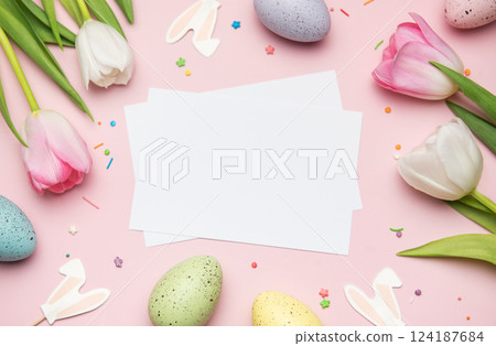 Easter greeting card mockup with colorful eggs and tulips on pink background 124187684