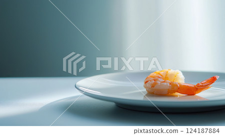 Fresh shrimp on white plate, showcasing its vibrant color and texture 124187884