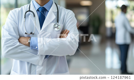 Healthcare professional in white coat with stethoscope, confident pose 124187961