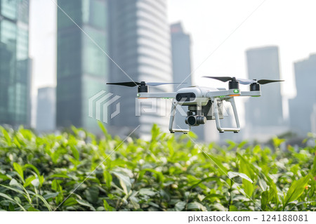 Drone delivering packages in green urban area, showcasing sustainable logistics innovation 124188081