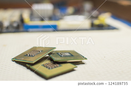 Computer microprocessors, three computer processors with one computer motherboard, computer processor concept 124189735