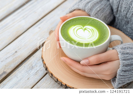 Woman having a calming moment with matcha tea 124191721