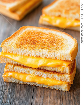 Golden Brown Grilled Cheese Sandwich on Wooden Table Golden Brown Grilled Cheese Sandwich on Wooden Table 124191777