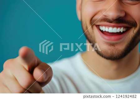 Man with joyful expression pointing forward Man with joyful expression pointing forward 124192482