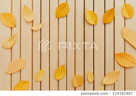 Seasonal Autumn Leaves on Wooden Surface 124192487