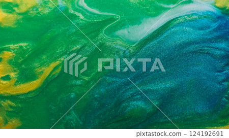 Acrylic blend. Fluid paint. Defocused yellow green blue colorful marble ink in water wave emulsion spilling on abstract background. Acrylic blend. Fluid paint. Defocused yellow green blue colorful marble ink in water wave emulsion spilling on abstract background. 124192691