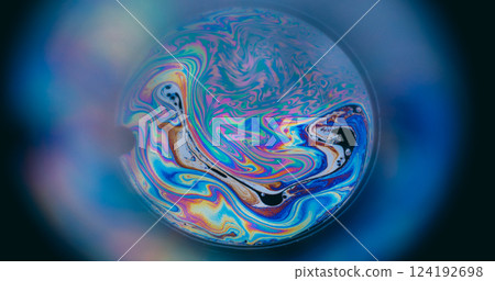 Holographic swirl. Spectrum oil mix. Round lens on blur color background. Abstract floating gasoline neon ink blend fluid black surface. 124192698
