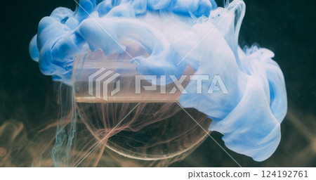 Fog paint. Sphere dripping. Defocused blue colorful water texture liquid vapor wave spreading on abstract art dark black background. Fog paint. Sphere dripping. Defocused blue colorful water texture liquid vapor wave spreading on abstract art dark black background. 124192761