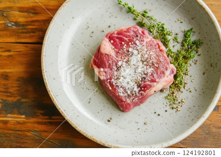 Raw Beef Fillet on a Modern Plate Close Up 124192801