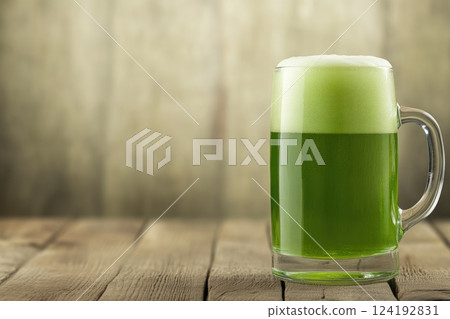 Green Beer on Wooden Background Green Beer on Wooden Background 124192831
