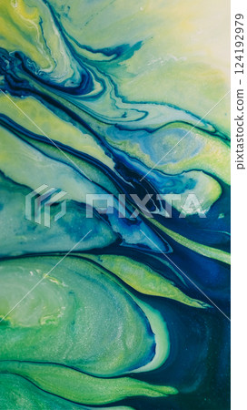 Emulsion water. Acrylic pour. Defocused blue green yellow color falling paint smooth texture wave fluid moving on abstract background. 124192979